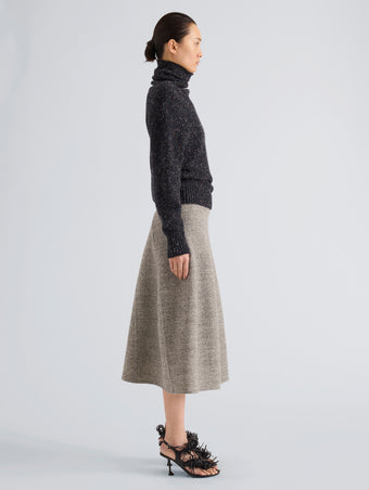 Proenza Schouler Side full length image of model wearing Abie Sweater in Donegal Knit in Black Multi