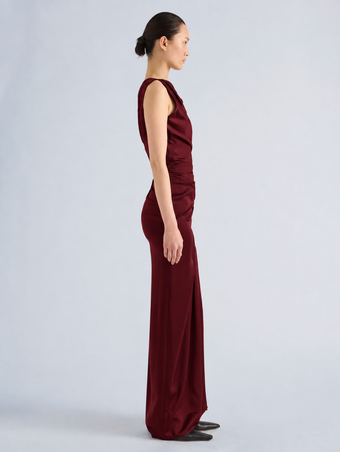 Proenza Schouler Side full length image of model wearing Isaline Dress in Crepe Satin in Amarone