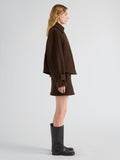 Proenza Schouler Side full length image of model wearing Clarice Skirt in Casentino Wool in Dark Brown