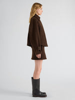 Proenza Schouler Side full length image of model wearing Clarice Skirt in Casentino Wool in Dark Brown