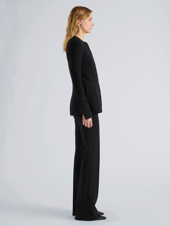 Proenza Schouler Side full length image of model wearing Sonia Pant in Bi-Stretch Suiting in Black