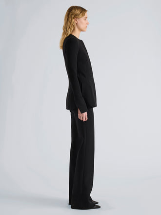 Proenza Schouler Side full length image of model wearing Sonia Pant in Bi-Stretch Suiting in Black