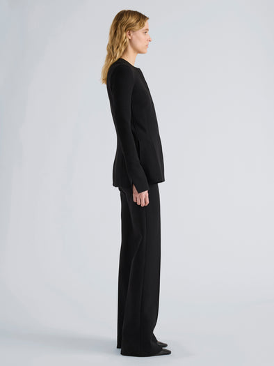 Proenza Schouler Side full length image of model wearing Sonia Pant in Bi-Stretch Suiting in Black