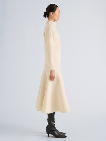 Proenza Schouler Side full length image of model wearing Lothea Skirt in Lofty Merino Wool in Ecru