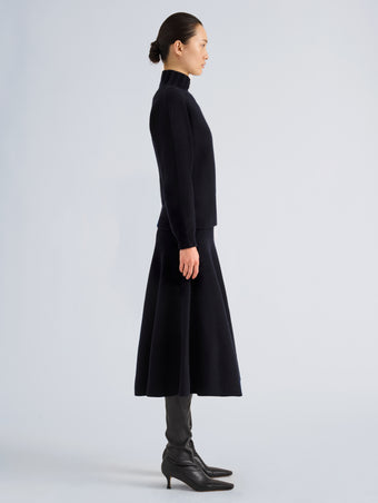 Proenza Schouler Side full length image of model wearing Lothea Skirt in Lofty Merino Wool in Navy Melange