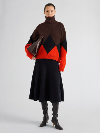 Proenza Schouler Front full length image of model wearing Oren Intarsia Turtleneck in Cashmere Wool in Red Multi