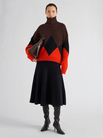 Proenza Schouler Front full length image of model wearing Oren Intarsia Turtleneck in Cashmere Wool in Red Multi