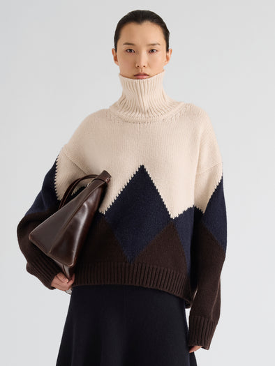 Proenza Schouler Front cropped image of model wearing Oren Intarsia Turtleneck in Cashmere Wool in Raisin Multi