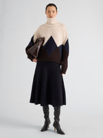 Proenza Schouler Front full length image of model wearing Oren Intarsia Turtleneck in Cashmere Wool in Raisin Multi