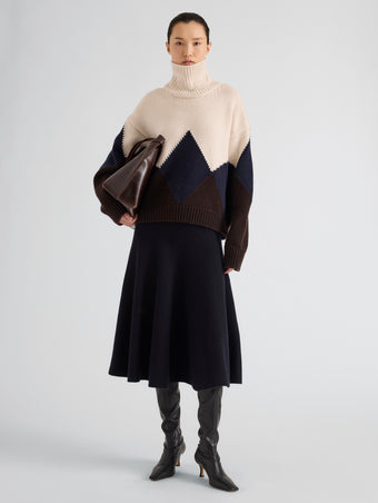 Proenza Schouler Front full length image of model wearing Oren Intarsia Turtleneck in Cashmere Wool in Raisin Multi