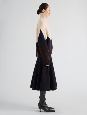 Proenza Schouler Side full length image of model wearing Oren Intarsia Turtleneck in Cashmere Wool in Raisin Multi