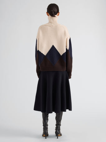 Proenza Schouler Back full length image of model wearing Oren Intarsia Turtleneck in Cashmere Wool in Raisin Multi
