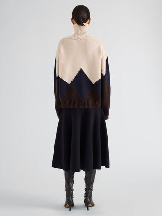 Proenza Schouler Back full length image of model wearing Oren Intarsia Turtleneck in Cashmere Wool in Raisin Multi