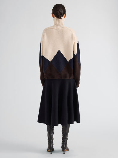Proenza Schouler Back full length image of model wearing Oren Intarsia Turtleneck in Cashmere Wool in Raisin Multi