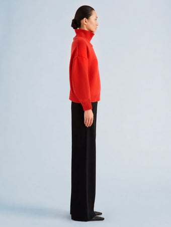 Proenza Schouler Side full length image of model wearing Oren Turtleneck in Cashmere Wool in Flame