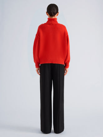 Proenza Schouler Back full length image of model wearing Oren Turtleneck in Cashmere Wool in Flame