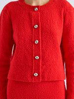 Proenza Schouler Detail image of model wearing Frida Cardigan in Wool Boucle in Poppy