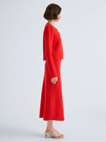 Proenza Schouler Side full length image of model wearing Frida Cardigan in Wool Boucle in Poppy