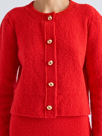 Proenza Schouler Detail image of model wearing Frida Cardigan in Wool Boucle in Poppy