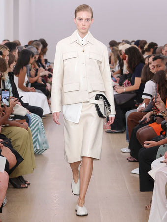 Runway image of model wearing Roos Jacket In Lacquered Leather in ecru