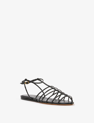 3/4 Front image of Tee Cage Flat Sandals in BLACK