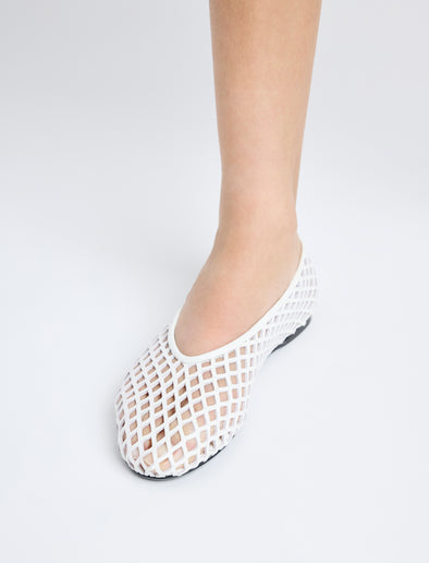 Image of model wearing Tee Perforated Ballerina Flats in IVORY