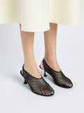 Image of model wearing Tee Perforated Slingback Pumps in BLACK