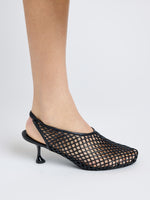Image of model wearing Tee Perforated Slingback Pumps in BLACK