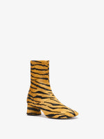 Proenza Schouler front 3/4 image of Glove Ankle Boots in Haircalf in orange/black