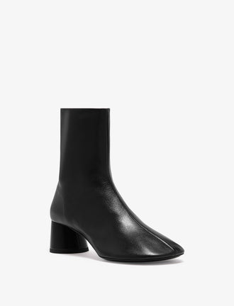 Proenza Schouler front 3/4 image of Glove Ankle Boots in Slick Nappa in black