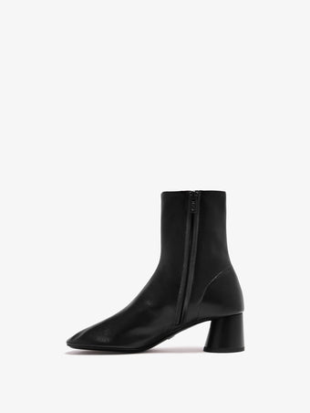 Proenza Schouler back 3/4 image of Glove Ankle Boots in Slick Nappa in black