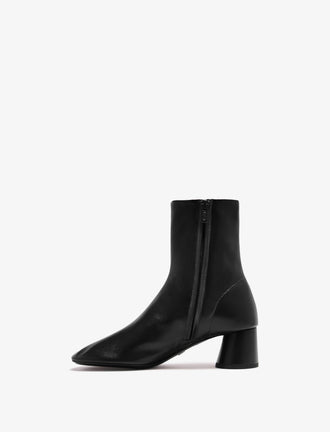 Proenza Schouler back 3/4 image of Glove Ankle Boots in Slick Nappa in black
