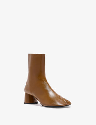 3/4 Front image of Glove Ankle Boots in Slick Nappa in Mud