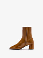 3/4 Back image of Glove Ankle Boots in Slick Nappa in Mud