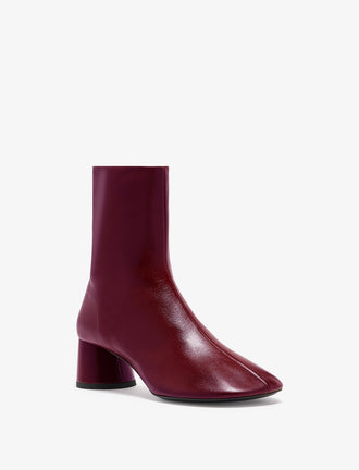 3/4 Front image of Glove Ankle Boots in Slick Nappa in Merlot