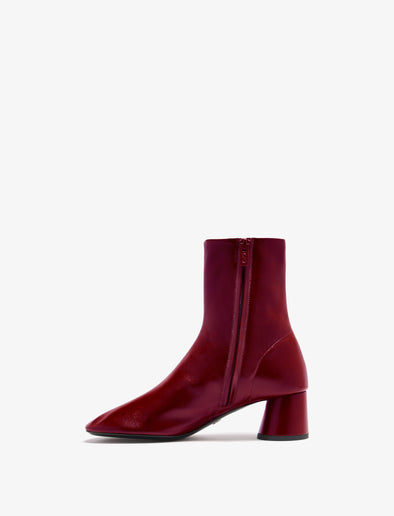 3/4 Back image of Glove Ankle Boots in Slick Nappa in Merlot