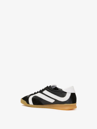 Proenza Schouler back 3/4 image of Track Sneakers in black with white stripes