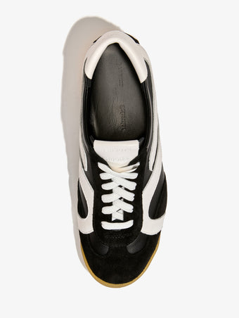 Proenza Schouler aerial image of Track Sneakers in black with white stripes