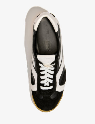 Proenza Schouler aerial image of Track Sneakers in black with white stripes
