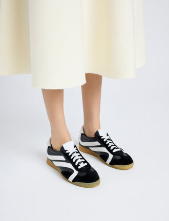 Proenza Schouler on model image of Track Sneakers in black with white stripes