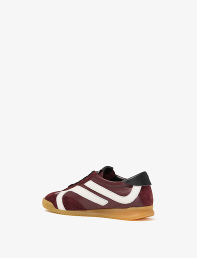 Back 3/4 image of Track Sneakers in colorway Oxblood and ivory stripes.