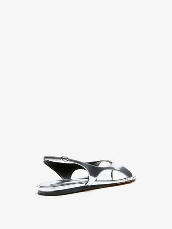 3/4 Back image of Slash Flat Thong Sandals in Silver