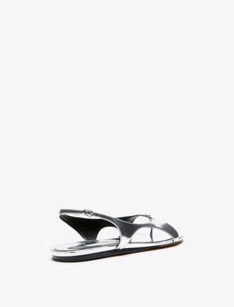 3/4 Back image of Slash Flat Thong Sandals in Silver