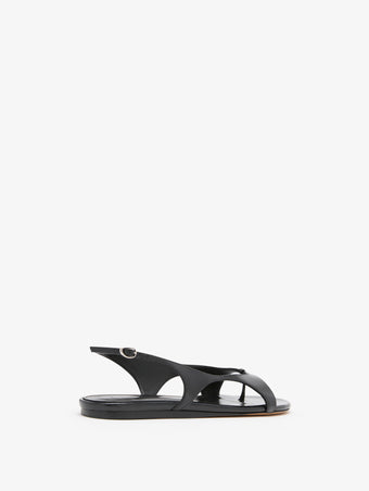3/4 Back image of Slash Flat Thong Sandals in Black