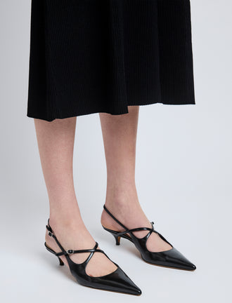 Image of model wearing Slash Crossover Slingback Pumps in Black