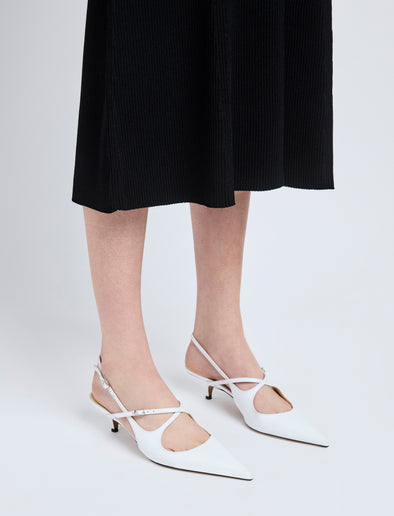 Image of model wearing Slash Crossover Slingback Pumps in White