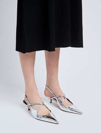 Image of model wearing Slash Crossover Slingback Pumps in Silver