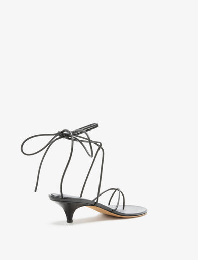 3/4 Back image of Slash Tie Sandals in Black