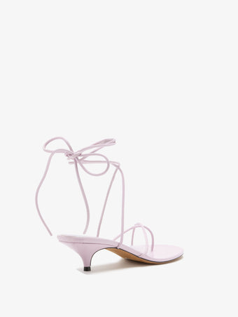 3/4 Back image of Slash Tie Sandals in Lilac