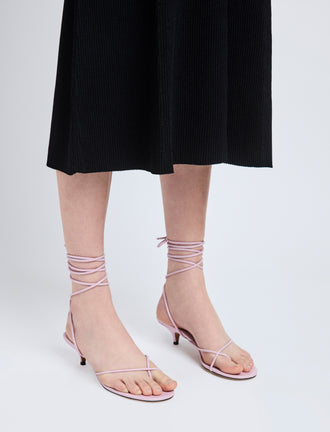 Image of model wearing Slash Tie Sandals in Lilac